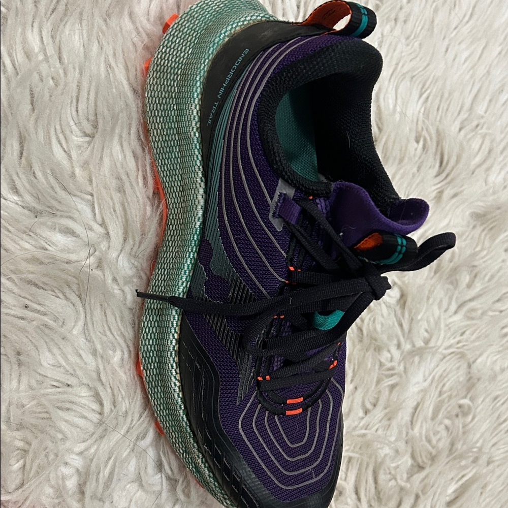 Purple and Black Athletic Shoes with Orange Accents